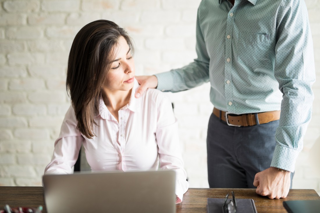 Unwanted touch on shoulder in workplace setting